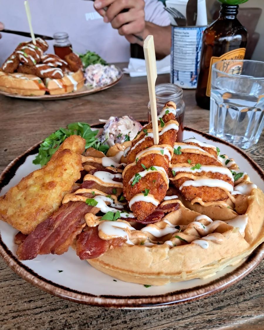 Fried Chicken waffles loaded with sauce, bacon and hash browns. A top feature in any Sheffield brunch guide thanks to its cosy atmosphere and indulgent menu.